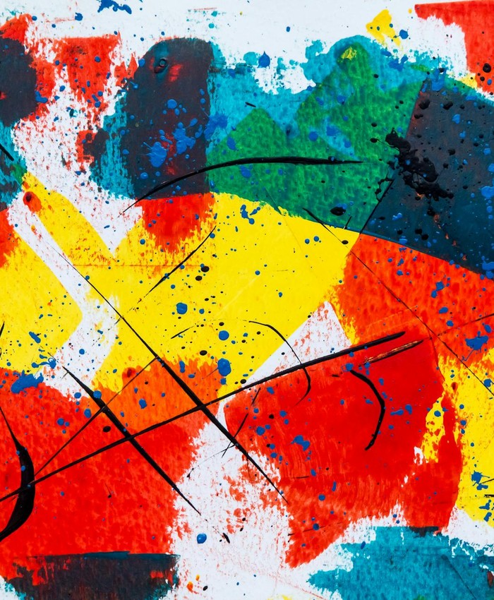Dynamic abstract art with bold colors and expressive brush strokes on canvas.